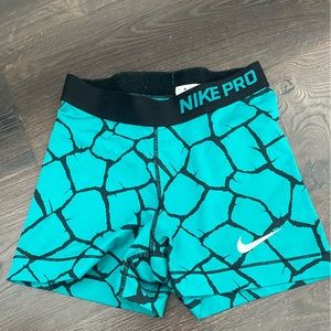teal blue nike pros
